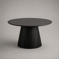 Table à manger ronde 120 x 75 cm noire en bois avec plateau rond et pied central cannelé